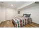 Charming basement bedroom with a bed and built-in closet at 1875 Jay St, Lakewood, CO 80214