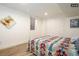 Spacious basement bedroom with a bed and built-in closet at 1875 Jay St, Lakewood, CO 80214