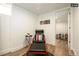 Relaxing basement sitting area with chair, ottoman, and view to bedroom at 1875 Jay St, Lakewood, CO 80214