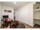 Cozy basement sitting area with a comfortable chair and ottoman at 1875 Jay St, Lakewood, CO 80214