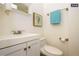 Clean bathroom with white vanity and a toilet at 1875 Jay St, Lakewood, CO 80214
