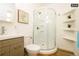 Clean bathroom featuring a rounded shower and modern vanity at 1875 Jay St, Lakewood, CO 80214