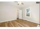 Bright bedroom with hardwood floors and ceiling fan at 1875 Jay St, Lakewood, CO 80214