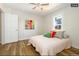 Bedroom with hardwood floors and colorful pillows at 1875 Jay St, Lakewood, CO 80214