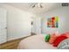Bedroom with hardwood floors and colorful artwork at 1875 Jay St, Lakewood, CO 80214