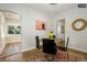 Dining room with hardwood floors and access to a sunroom at 1875 Jay St, Lakewood, CO 80214