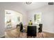 Bright dining area with hardwood floors and an archway at 1875 Jay St, Lakewood, CO 80214