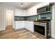 Modern kitchen with stainless steel appliances at 1875 Jay St, Lakewood, CO 80214