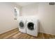 Laundry room with washer and dryer, and a window at 1875 Jay St, Lakewood, CO 80214