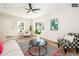 Bright living room with hardwood floors and ceiling fan at 1875 Jay St, Lakewood, CO 80214