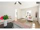 Bright living room with hardwood floors and ceiling fan at 1875 Jay St, Lakewood, CO 80214