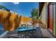 Small patio with table and chairs, next to the house at 1875 Jay St, Lakewood, CO 80214