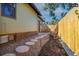 Relaxing side yard with stone pathway and rocking chairs at 1875 Jay St, Lakewood, CO 80214