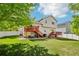 Expansive backyard with lawn, fence, and a two-level wooden deck for outdoor enjoyment at 16304 10Th St, Mead, CO 80542