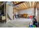 Unfinished basement with concrete floors, exposed ceiling, and some storage items at 16304 10Th St, Mead, CO 80542