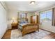 Comfortable bedroom with hardwood floors and a wooden bed frame at 16304 10Th St, Mead, CO 80542