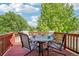 Inviting outdoor deck with a table and four chairs, perfect for relaxing and entertaining at 16304 10Th St, Mead, CO 80542