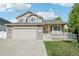 Charming two-story home with a covered porch and well-maintained lawn at 16304 10Th St, Mead, CO 80542