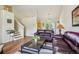 Cozy living room with hardwood floors and comfortable leather sofas at 16304 10Th St, Mead, CO 80542