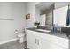 Bathroom features include a single vanity, sleek fixtures and ample counter space at 20 Wilcox St # 403, Castle Rock, CO 80104