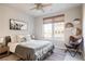 Bright bedroom with a queen-size bed, large window, and ceiling fan at 20 Wilcox St # 403, Castle Rock, CO 80104