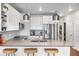 Modern kitchen with white cabinets, stainless steel appliances and island with seating at 20 Wilcox St # 403, Castle Rock, CO 80104