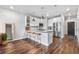 Modern kitchen with stainless steel appliances, an island, counter seating and hard wood floors at 20 Wilcox St # 403, Castle Rock, CO 80104