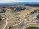 Sweeping aerial view of a residential community showcasing picturesque landscaping, walking paths and proximity to parks at 904 Sundown Way, Erie, CO 80516