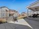 Backyard featuring a built-in grill area, concrete patio, and covered porch with ceiling fans at 904 Sundown Way, Erie, CO 80516