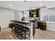 Stylish basement bar with seating, modern lighting, and a custom barrel accent for a unique touch at 904 Sundown Way, Erie, CO 80516