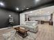 Finished basement featuring a seating area and a popcorn machine for an ultimate entertainment space at 904 Sundown Way, Erie, CO 80516