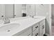 Modern bathroom with dual sinks, sleek countertops, and dark hardware at 904 Sundown Way, Erie, CO 80516