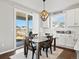 Dining area with backyard view and a 'Home Sweet Home' sign above the cabinets at 904 Sundown Way, Erie, CO 80516