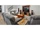 Spacious living room with cozy seating, a large TV, and plenty of room for relaxation and entertainment at 904 Sundown Way, Erie, CO 80516