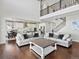 Open concept living room, dining area, and kitchen with a view of the second floor at 904 Sundown Way, Erie, CO 80516