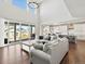Open concept living room, dining area, and kitchen with sliding door access to patio at 904 Sundown Way, Erie, CO 80516
