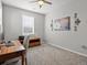 Well-lit home office featuring a window, desk, and storage unit, ideal for remote work at 904 Sundown Way, Erie, CO 80516