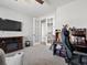 Well-lit carpeted office featuring a fireplace and white french doors at 904 Sundown Way, Erie, CO 80516