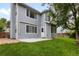 A charming two-story home with landscaped yard and a concrete patio for outdoor entertaining at 19135 E Hickock Dr, Parker, CO 80134