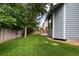 Backyard featuring partial green lawn and perimeter wood fence at 19135 E Hickock Dr, Parker, CO 80134