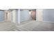 A spacious basement with light blue walls, carpet, and several access doors for storage and utilities at 19135 E Hickock Dr, Parker, CO 80134
