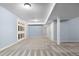 A spacious basement with light blue walls, carpet, and several access doors for storage and utilities at 19135 E Hickock Dr, Parker, CO 80134