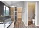 Modern bathroom with a glass shower, stylish vanities, and tile accents at 19135 E Hickock Dr, Parker, CO 80134