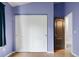Bedroom featuring a window, storage, and stylish door at 19135 E Hickock Dr, Parker, CO 80134