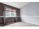 Bedroom featuring stylish trim, carpet, and a bright window at 19135 E Hickock Dr, Parker, CO 80134