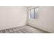 Bedroom with neutral carpet and single horizontal window at 19135 E Hickock Dr, Parker, CO 80134