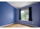 Bright bedroom with a large window, featuring hardwood floors at 19135 E Hickock Dr, Parker, CO 80134