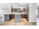 Modern kitchen with gray cabinets, stainless steel appliances, and a kitchen island at 19135 E Hickock Dr, Parker, CO 80134