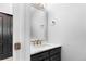 This powder room includes a marble sink and modern fixtures at 19135 E Hickock Dr, Parker, CO 80134