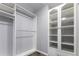 Spacious walk-in closet with custom shelves and ample storage for clothing and accessories at 19135 E Hickock Dr, Parker, CO 80134